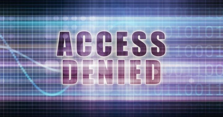 The words “Access Denied” over a digital composite of a data stream