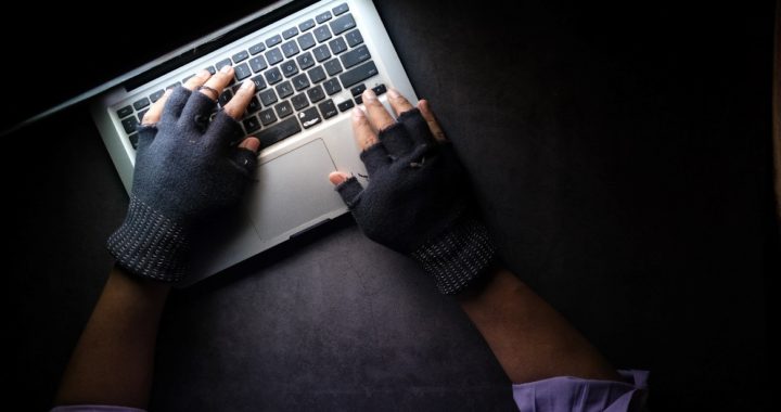a hacker hacking a laptop