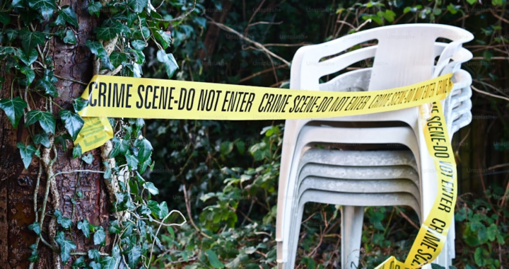 An image of chairs next to yellow caution tape