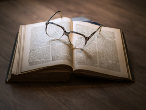 An image of a book and glasses