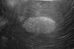 An image of a fingerprint on a black surface 