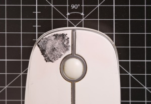 An image of a fingerprint on a mouse
