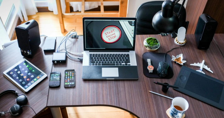 Several digital devices placed on a desk