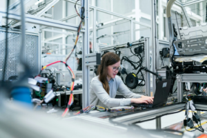 A female scientist reviews information on a computer monitor