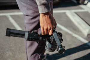 A person holding a video camera.