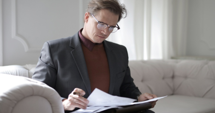 Man in a suit working on documents