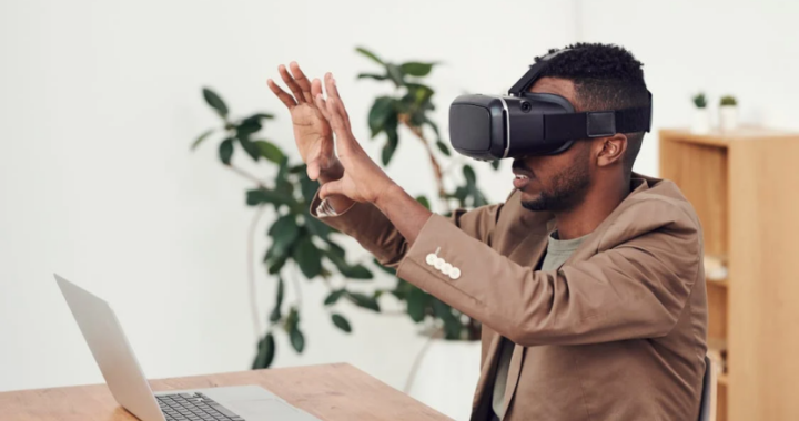 An image of a man using VR goggles