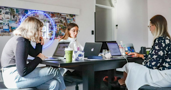 three people working on laptops