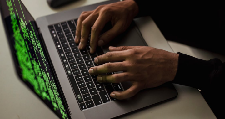 a digital forensic expert at work on their laptop