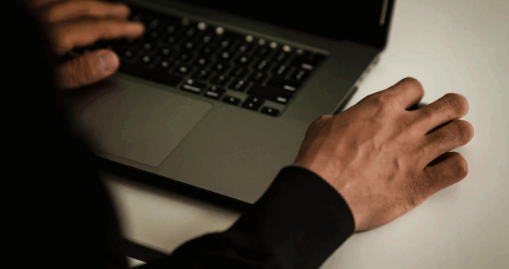 A forensic computer analyst analyzing evidence.