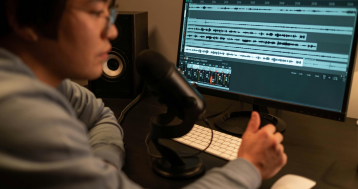 Audio expert enhancing a distorted recording using professional software