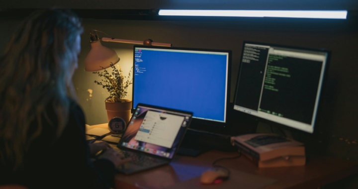 forensic expert analyzing digital evidence on multiple computer screens