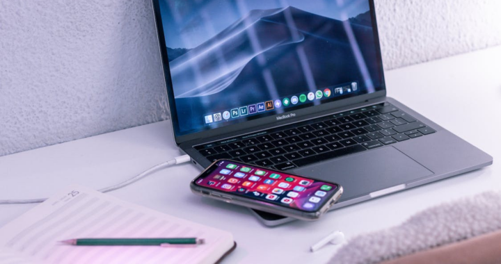 a laptop on a white surface.