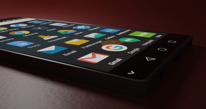 Open screen smartphone lying on a wooden surface
