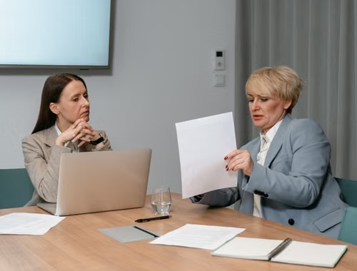 person sitting and working at their desk.