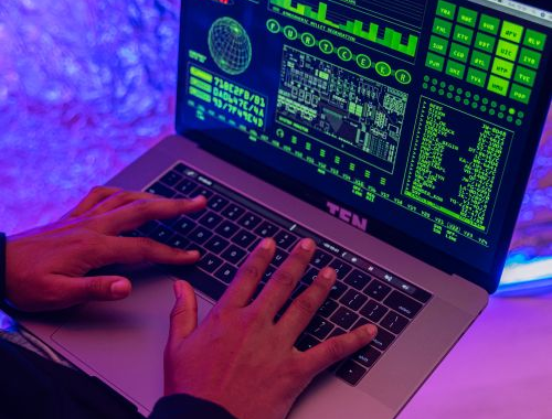 a person using their laptop for video analysis.