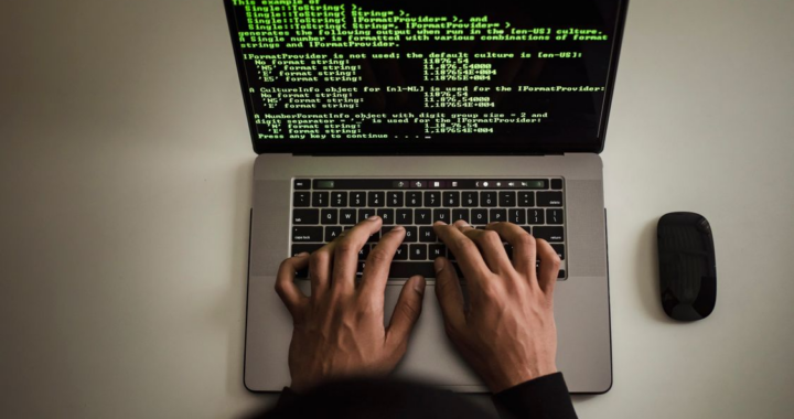 a video analyst working on a laptop.