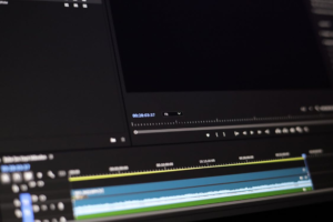 Video editing timeline on a dark monitor used for frame by frame review